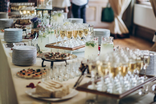 Stylish,Champagne,Glasses,And,Food,Appetizers,On,Table,At,Wedding